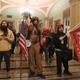 Supporters of US President Donald Trump, including member of the QAnon conspiracy group Jake Angeli, aka Yellowstone Wolf (C), enter the US Capitol on January 6, 2021, in Washington, DC.